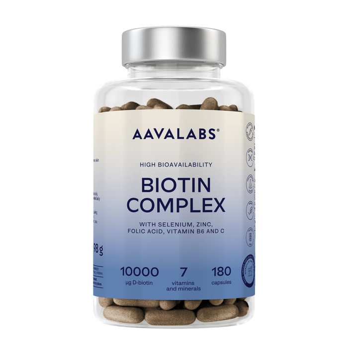 A clear plastic bottle of Aavalabs Biotin Complex dietary supplement capsules with a silver cap and a white-to-blue gradient label, shown on a plain white background.
