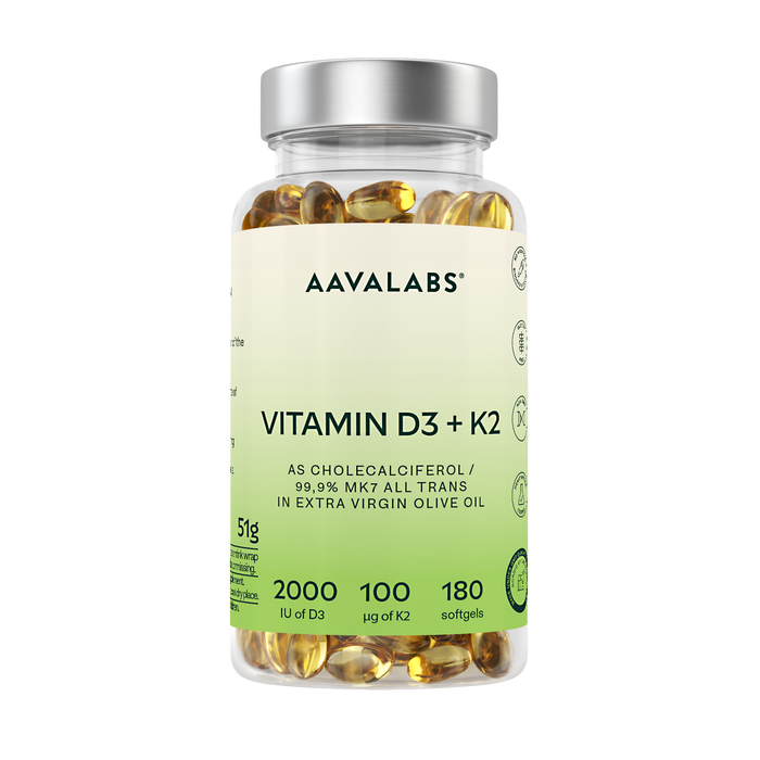 A clear plastic bottle of AAVALABS Vitamin D3 + K2 softgels with a silver cap and a light green-to-white label, filled with yellow-gold softgels, on a solid white background.