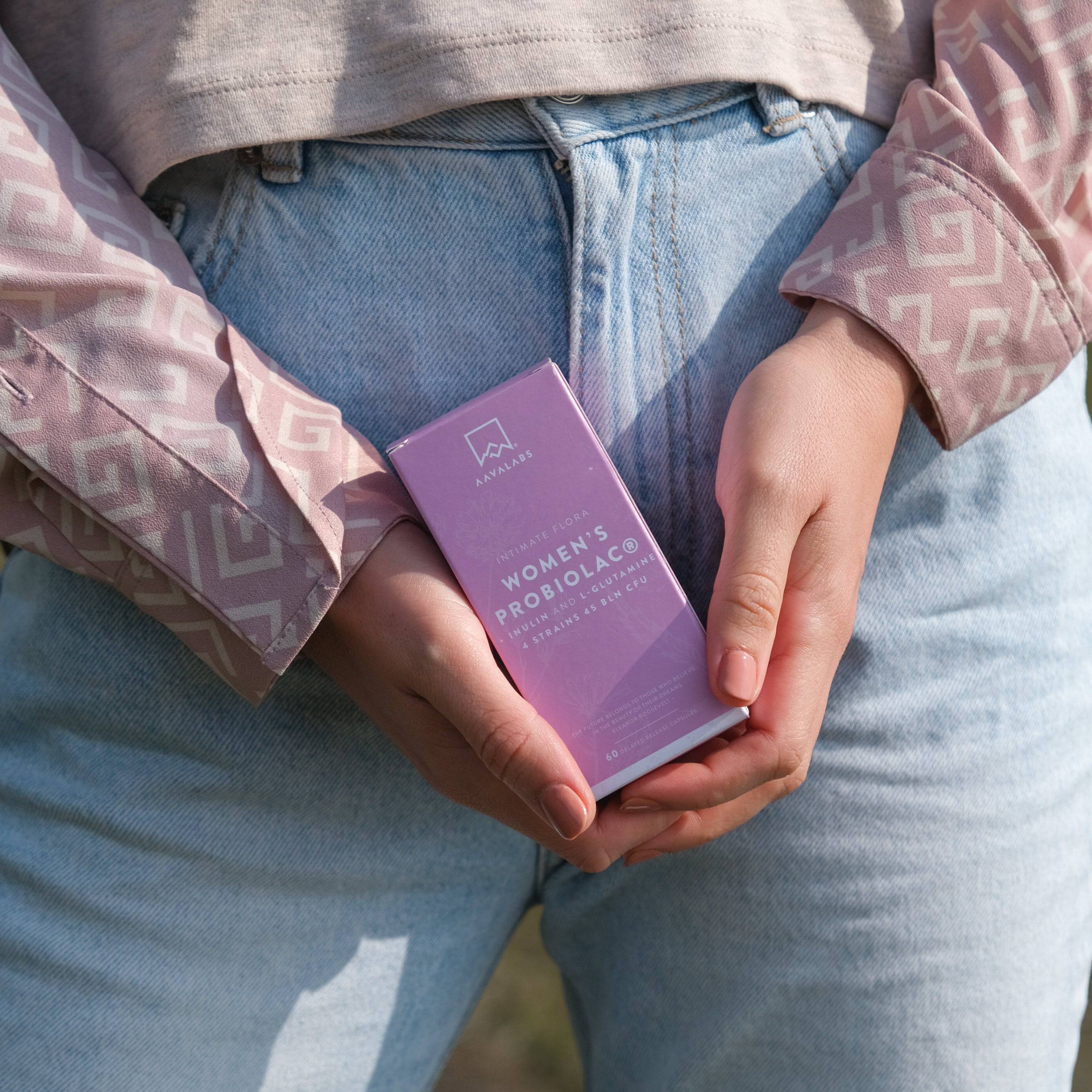 Bottle and Box of Women Probiolac in Hands - AAVALABS